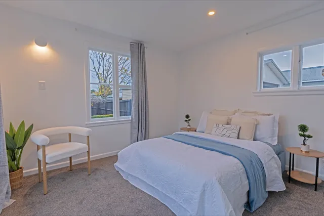 Staged bedroom with blue throw