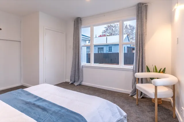 Staged bedroom corner with reading chair