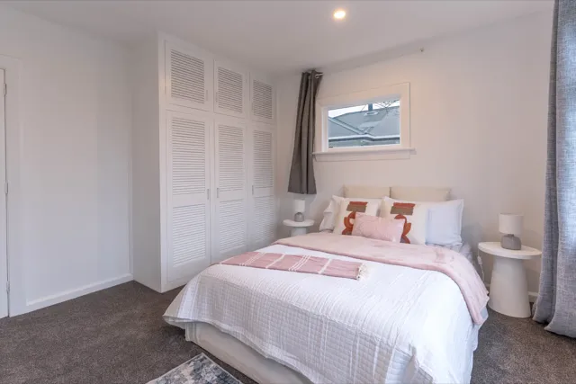 Staged bedroom with louvre wardrobes