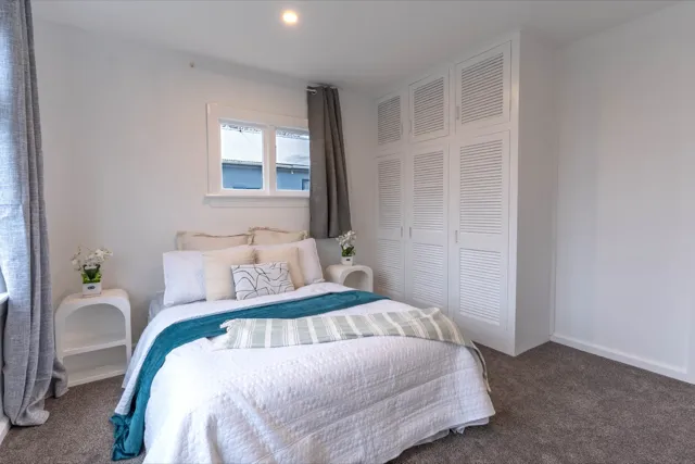 Staged bedroom with teal accents