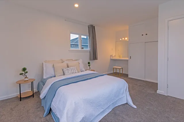 Staged master bedroom with vanity