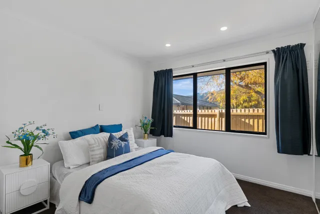 Staged bedroom with blue accents