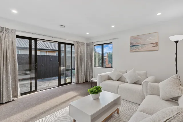 Staged living room with courtyard outlook