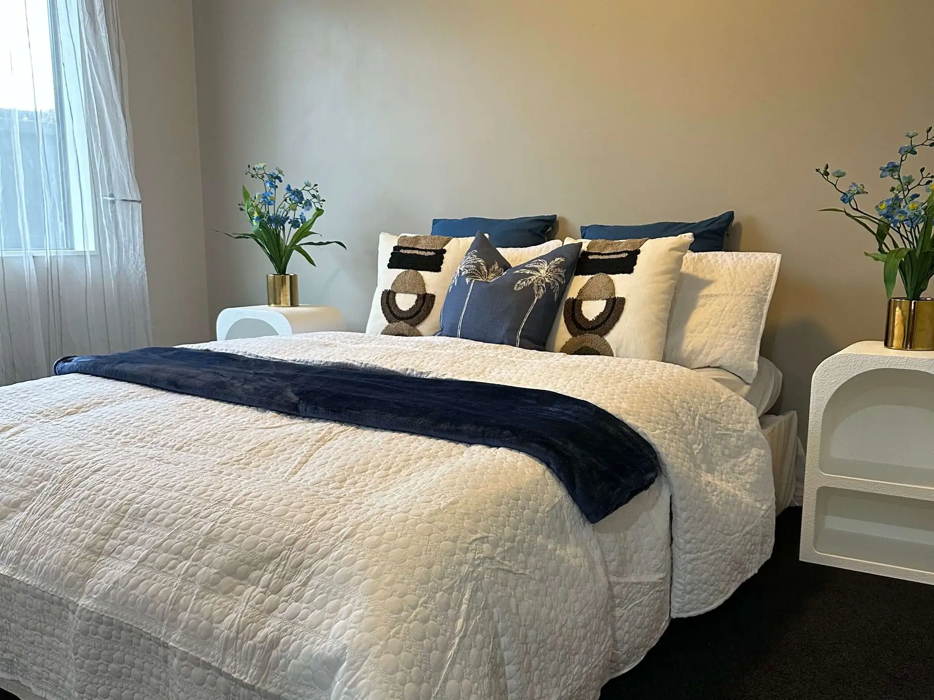Styled bedroom with blue accents